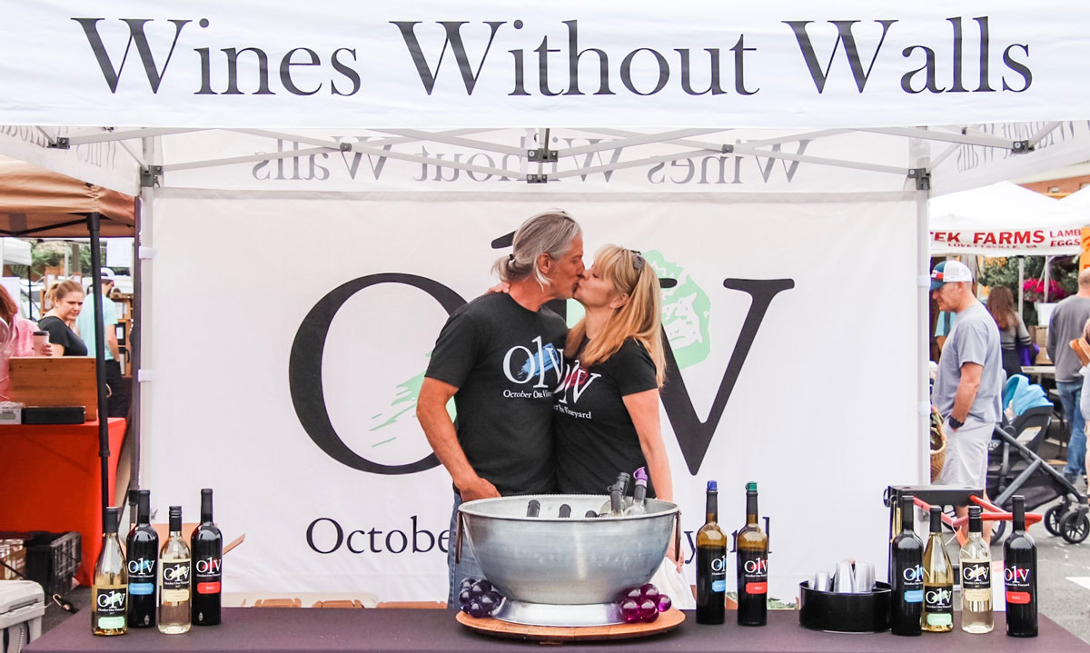 Bob Rupy and Loree Rupy at the Leesburg Farmer's Market selling their wine, O1V