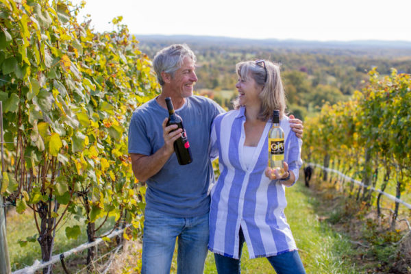 Bob and Loree Rupee with the Virginia Wine Club Wines in the vineyard