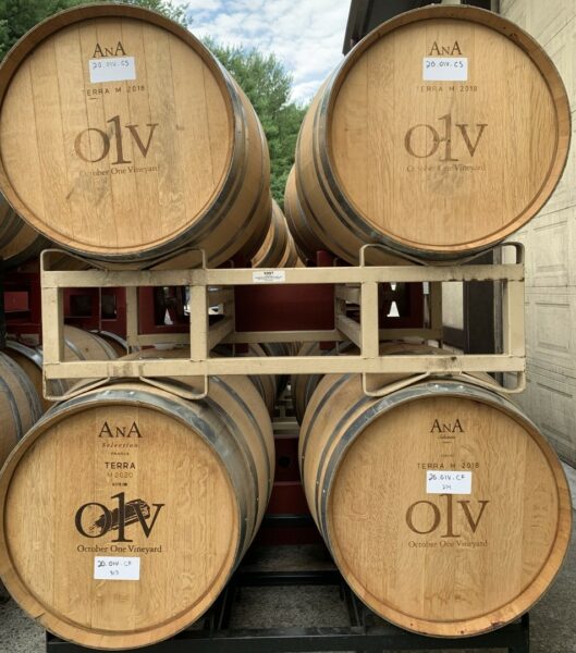 Oak barrels full of October One Vineyard's Cabernet Franc and Cabernet Sauvignon wine.